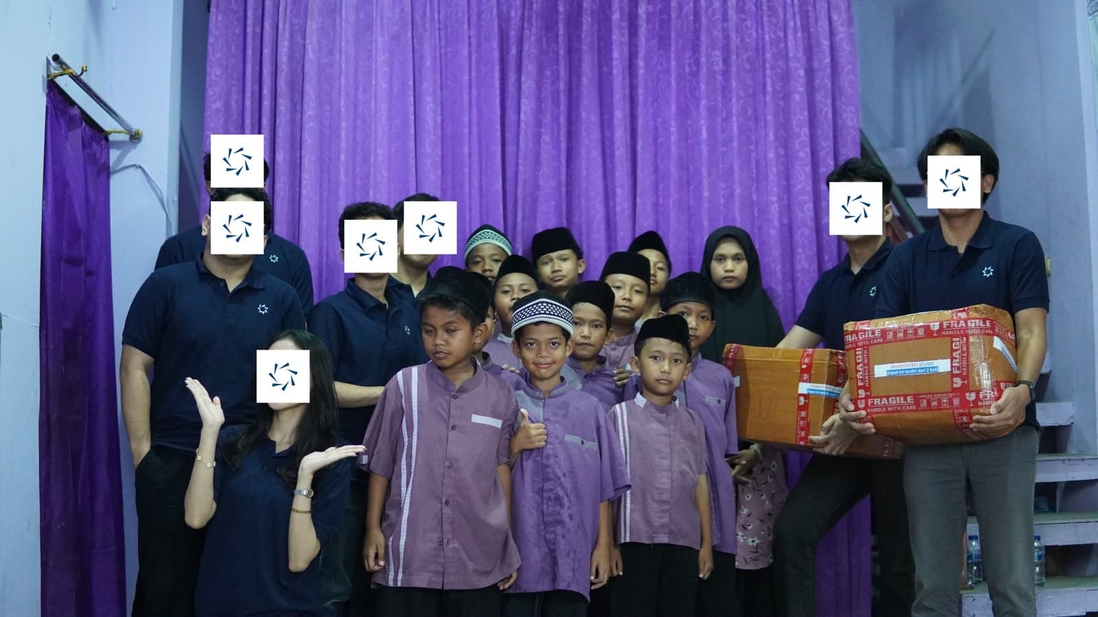 NiFiBerbagi spending time with children at an orphanage